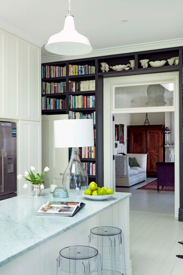 Dark cabinetry makes a statement against the white surrounds.