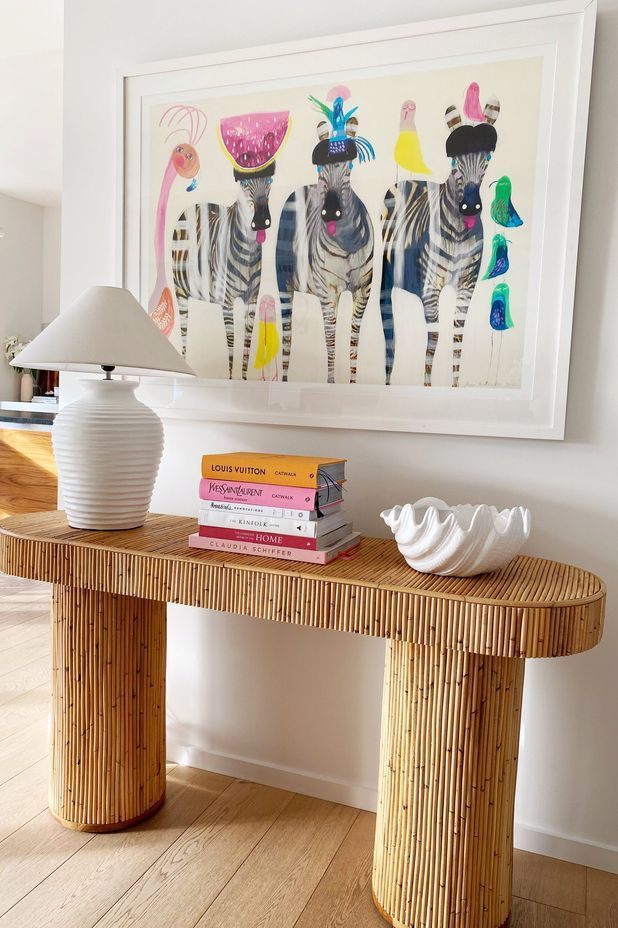 A bamboo side table gives a glimpse of what to expect with the bamboo ceiling.