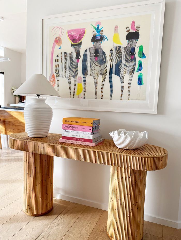 A bamboo side table gives a glimpse of what to expect with the bamboo ceiling.