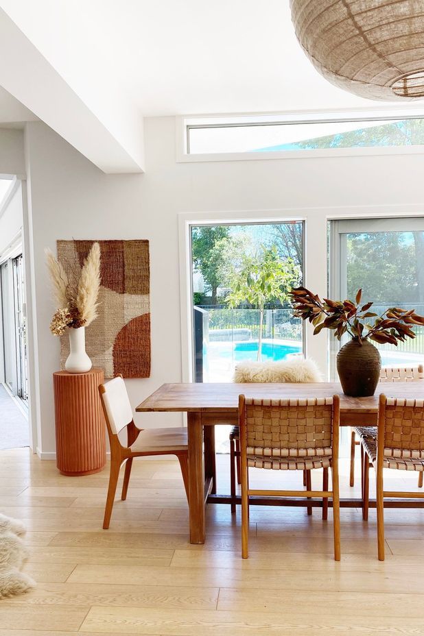 The dining table from Hawthorn Collections pairs with leather chairs in the dining area.