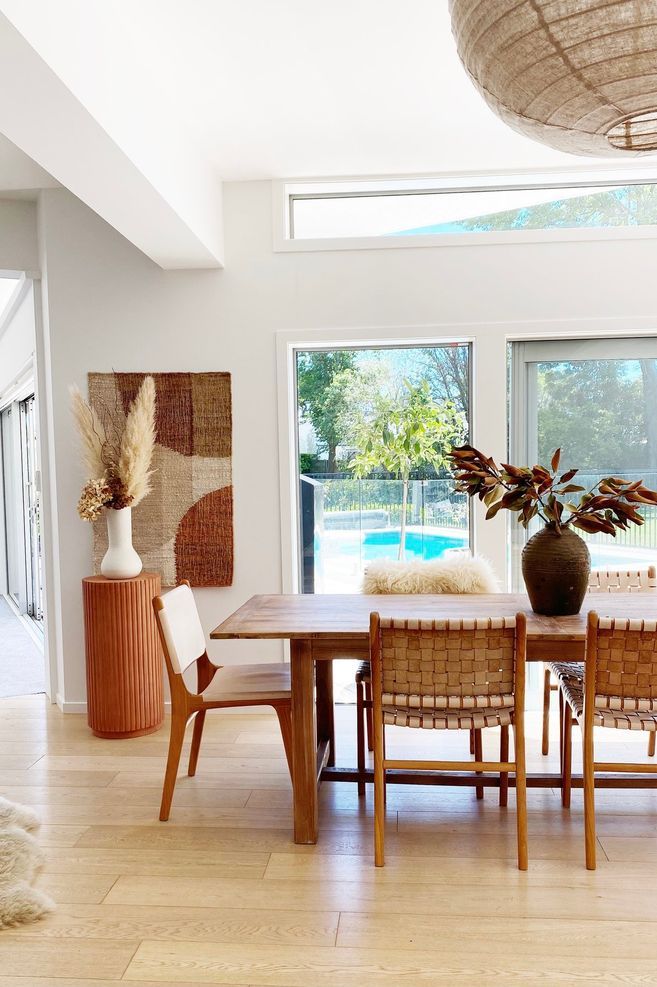 The dining table from Hawthorn Collections pairs with leather chairs in the dining area.