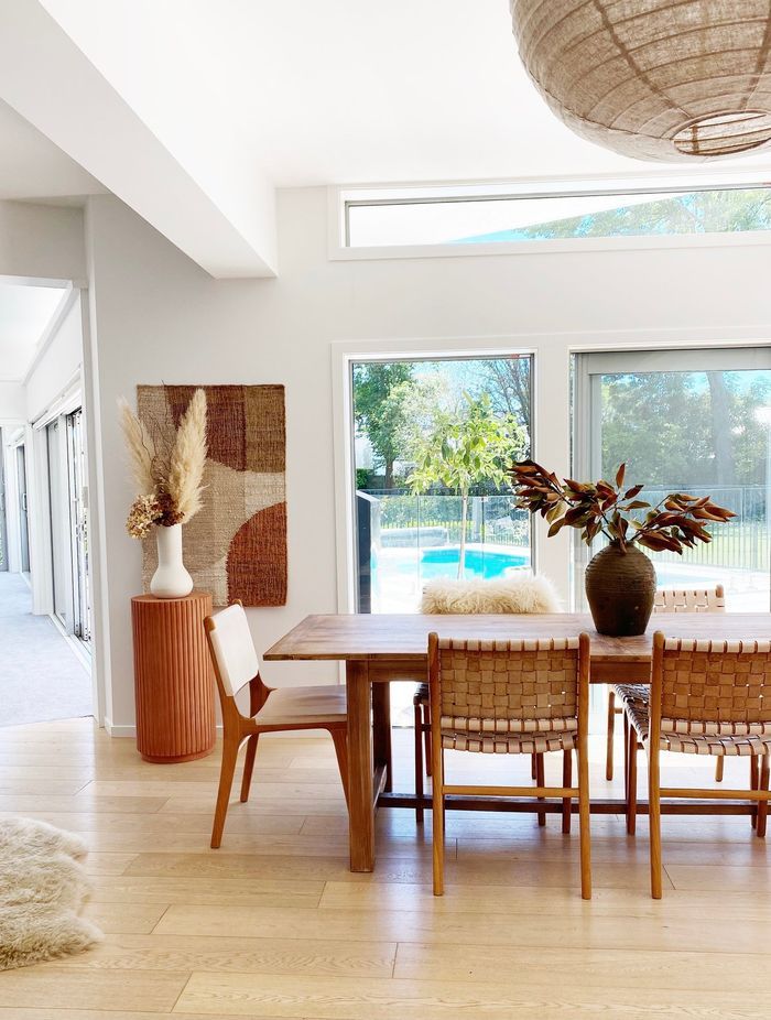 The dining table from Hawthorn Collections pairs with leather chairs in the dining area.