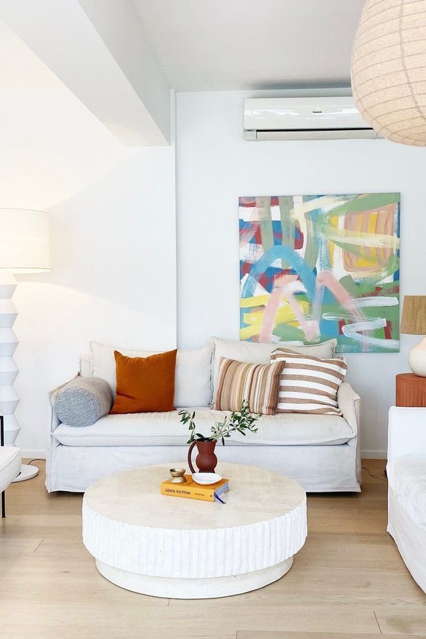 A stone coffee table from David Shaw brings texture to the living area.