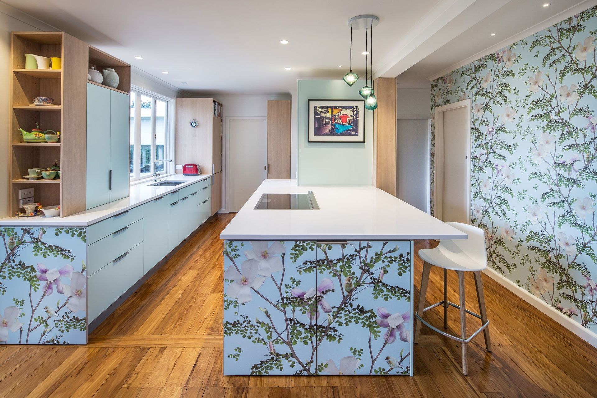 "The Magnolia Kitchen design was built around the client’s love of a magnolia wall mural."