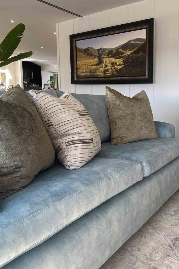 "For the living room, we took the hues and tones from another photo the family had taken at a holiday spot they love.”