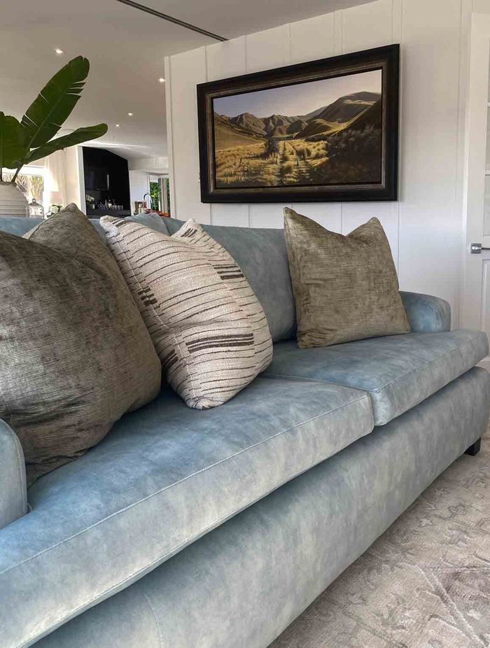 "For the living room, we took the hues and tones from another photo the family had taken at a holiday spot they love.”