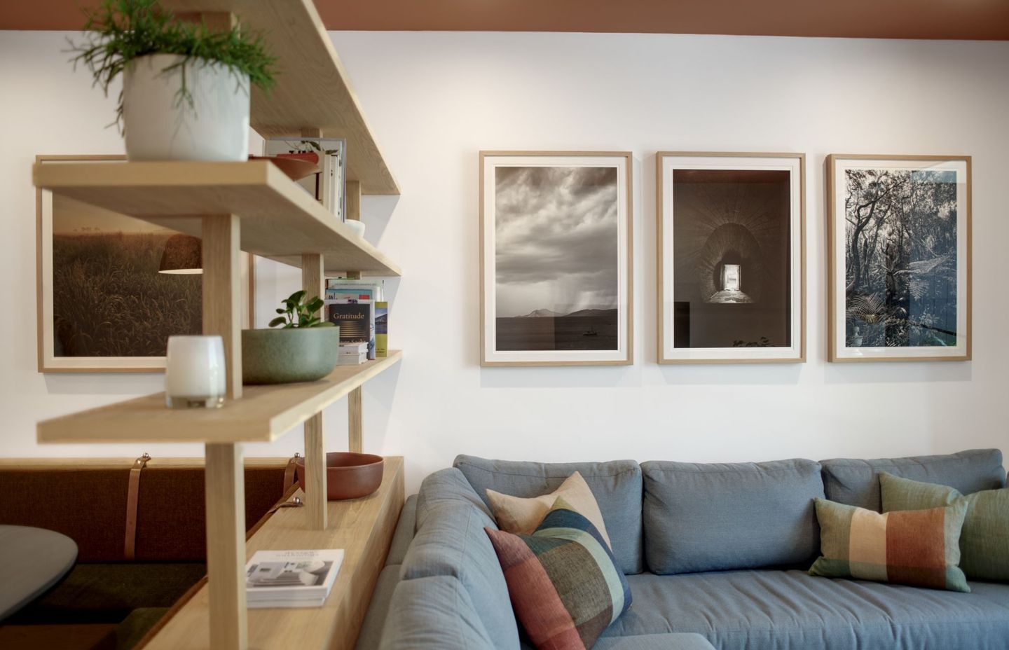 Kanat Studio used the client’s photography throughout this apartment to add a personal touch | Photography by Ben Rowsell