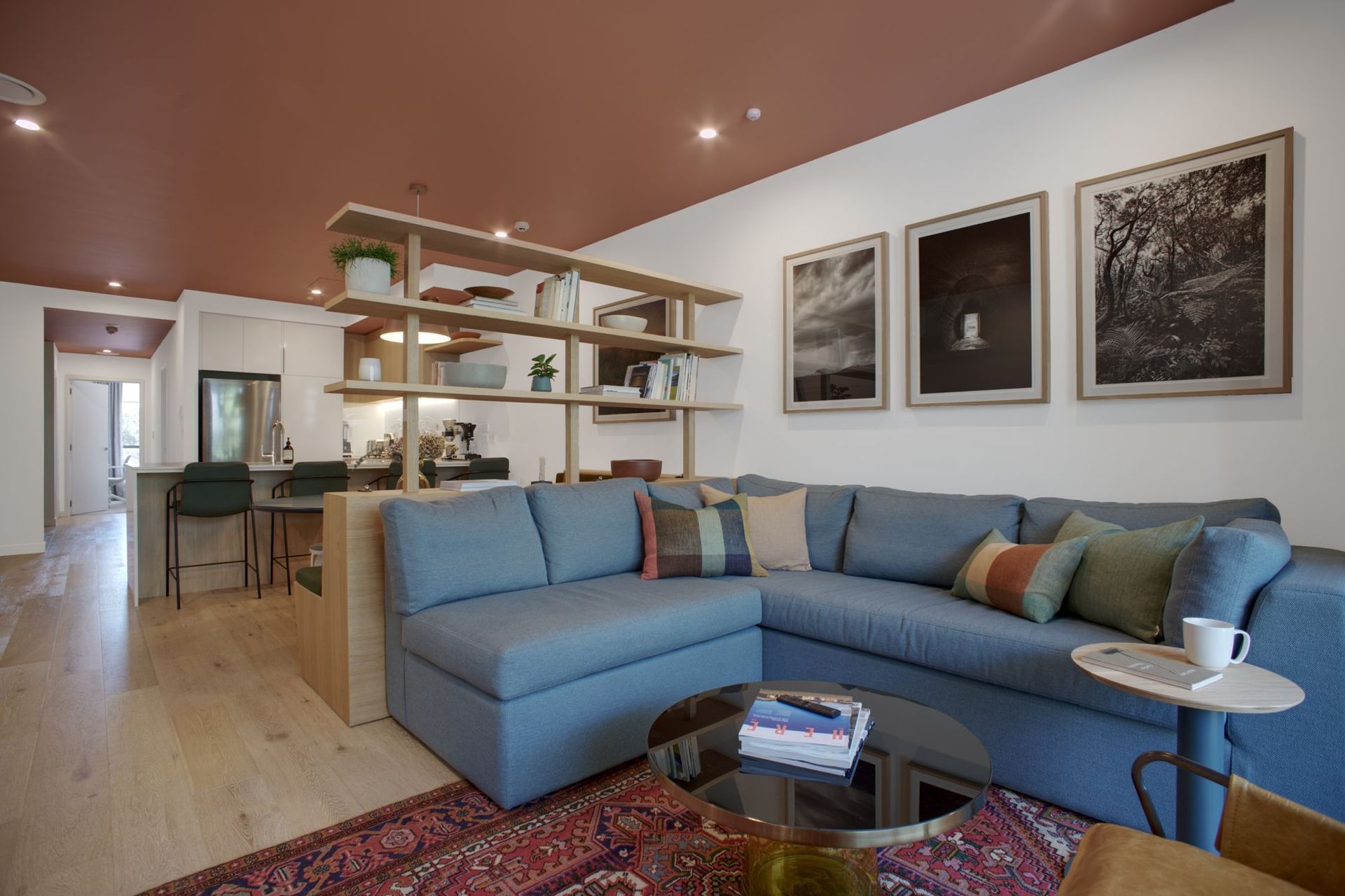 In the Kimiora Apartment project, Kate and Natalia chose a terracotta paint colour for the ceiling to create an intimate atmosphere | Photography by Ben Rowsell
