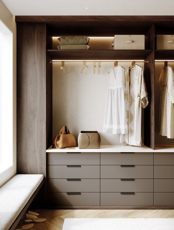 A refined wardrobe detail featuring DesignerOne’s rich woodgrain tones paired with soft, neutral drawer fronts for a beautifully balanced interior finish.