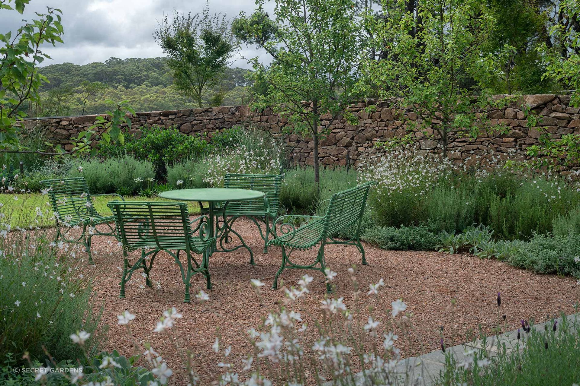 Secret Gardens carried out a comprehensive landscape transformation in the Southern Highlands, featuring stone walling, pathways, and diverse seating areas, designed in collaboration with Emma Lee Architecture.