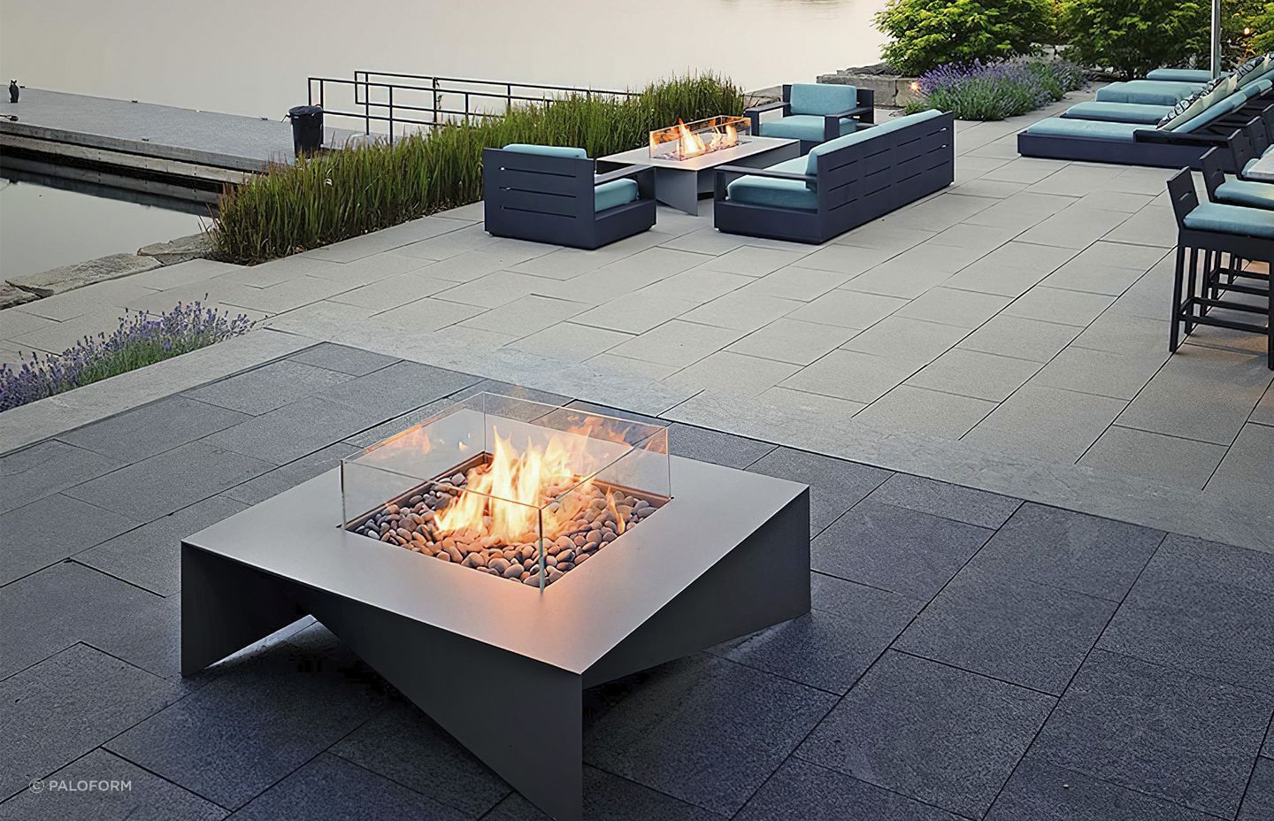 The delicate aluminium planes of the Fold Fire Table touch the ground at each corner in a way that exudes quality