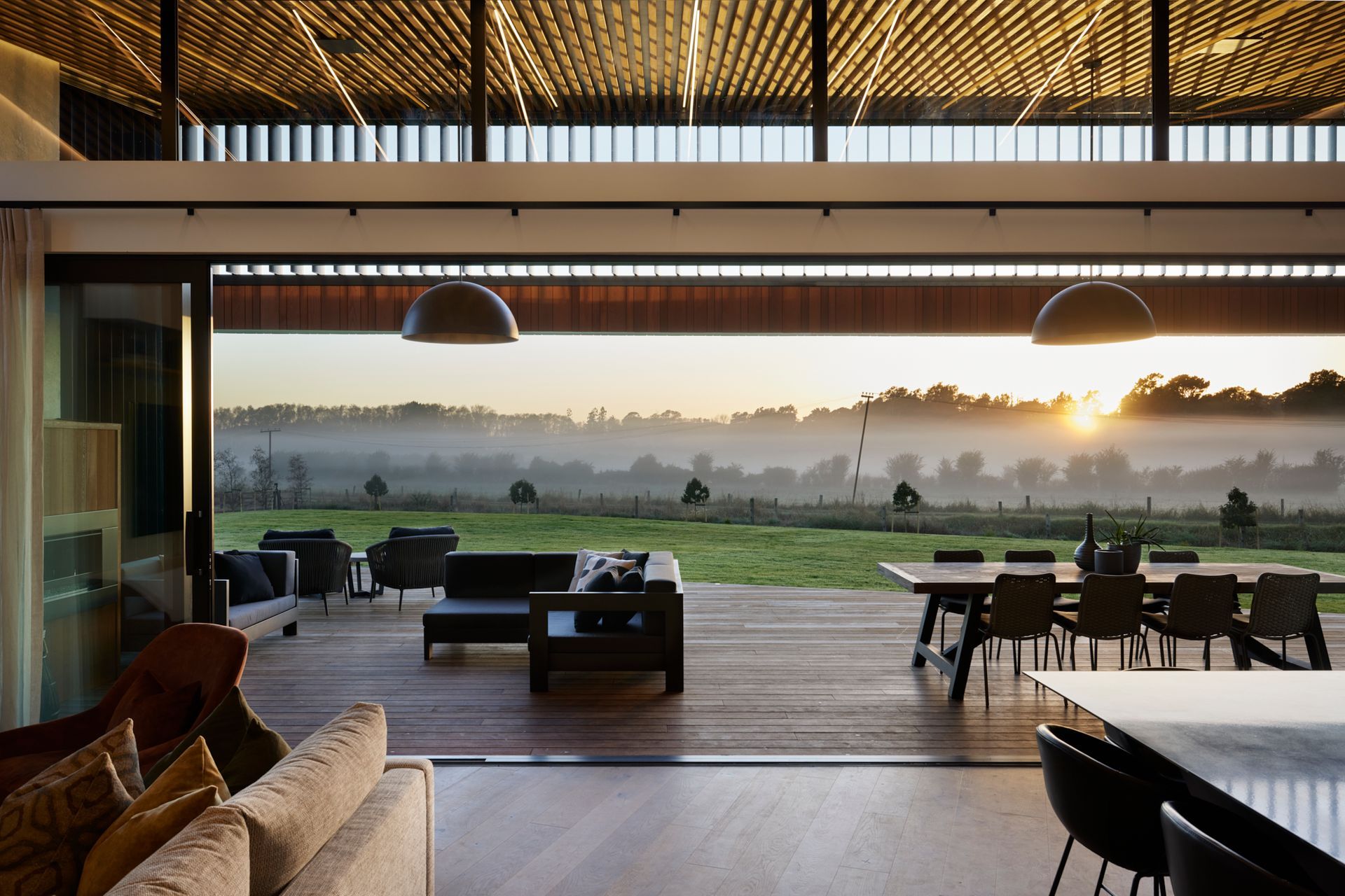 Perfect for entertaining, the outdoor living space is an extension of the home’s internal main living area. Accessed through large glass sliding doors, it is complete with a fireplace and bar access.