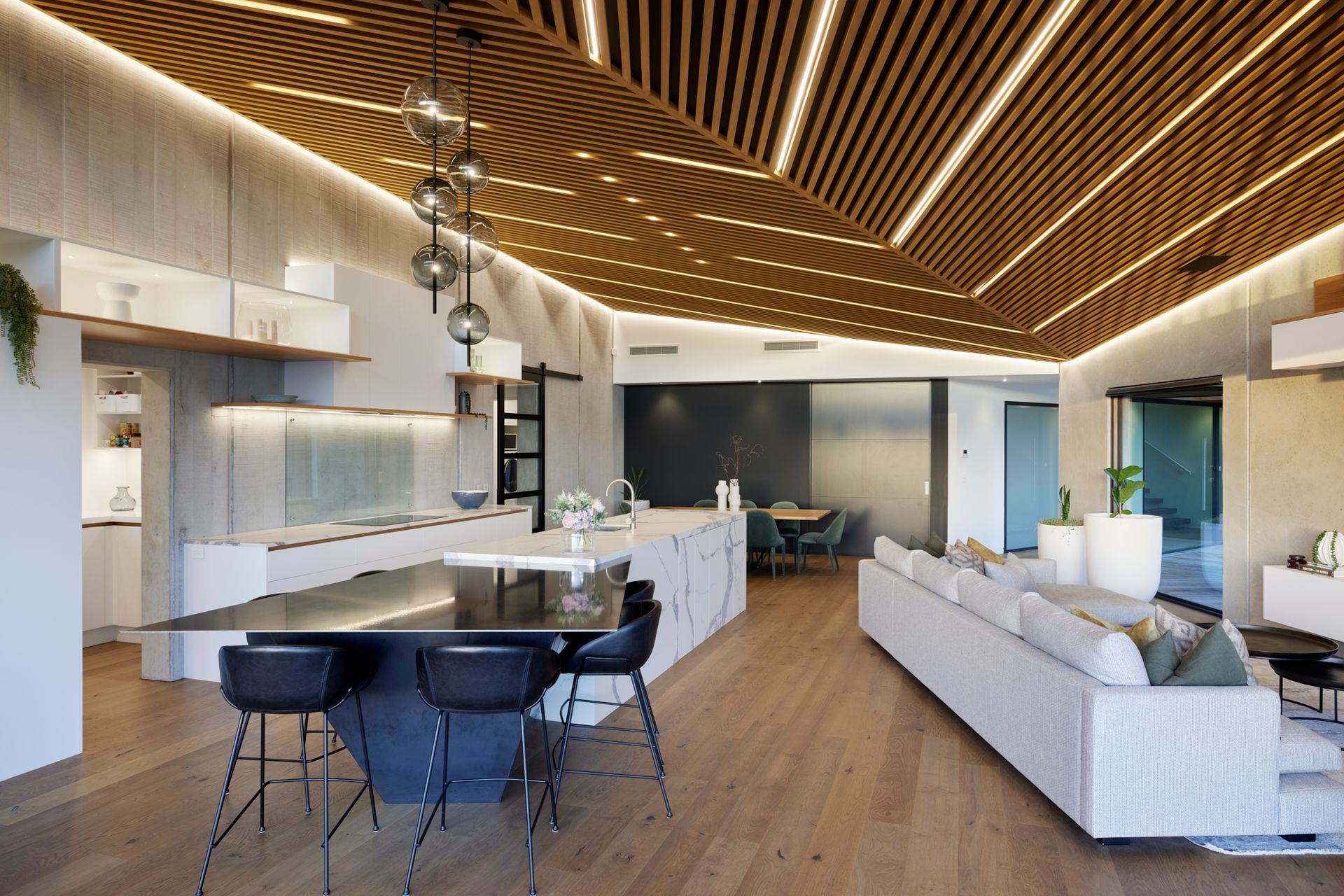 “The whole area comes alive at night as light accentuates the textures and the cedar-slatted ceiling is stunning with the in-laid linear lights – it’s fantastic at night,” says Lee.