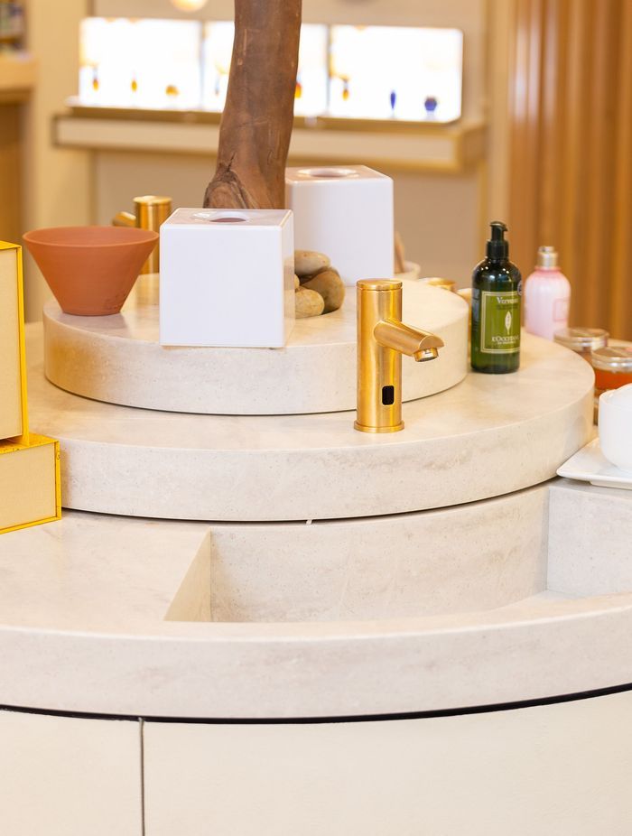 An elegant brushed-gold finish to complement the marble basin.