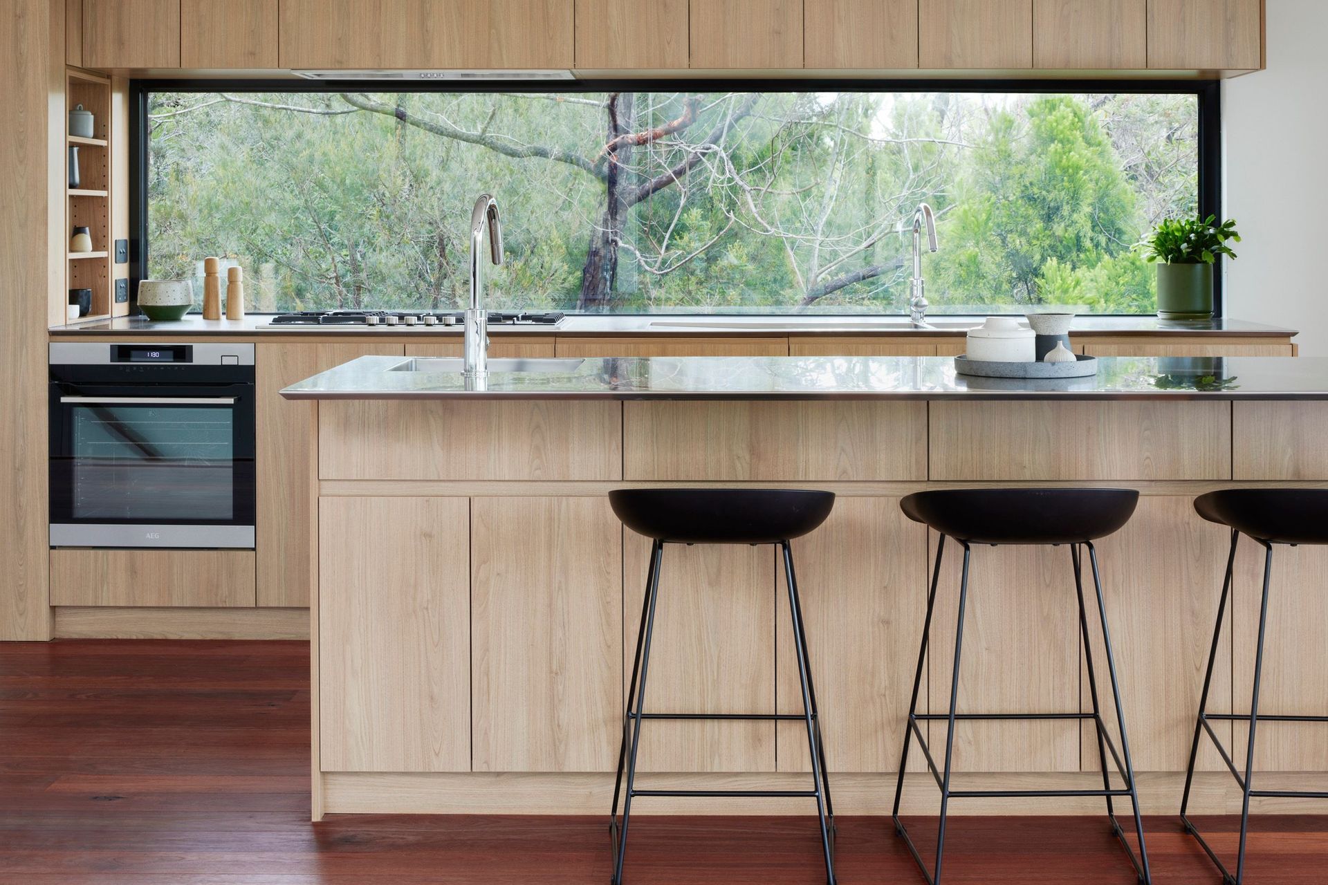 A window has been chosen as the kitchen splashback to maximise natural light and the beautiful view.