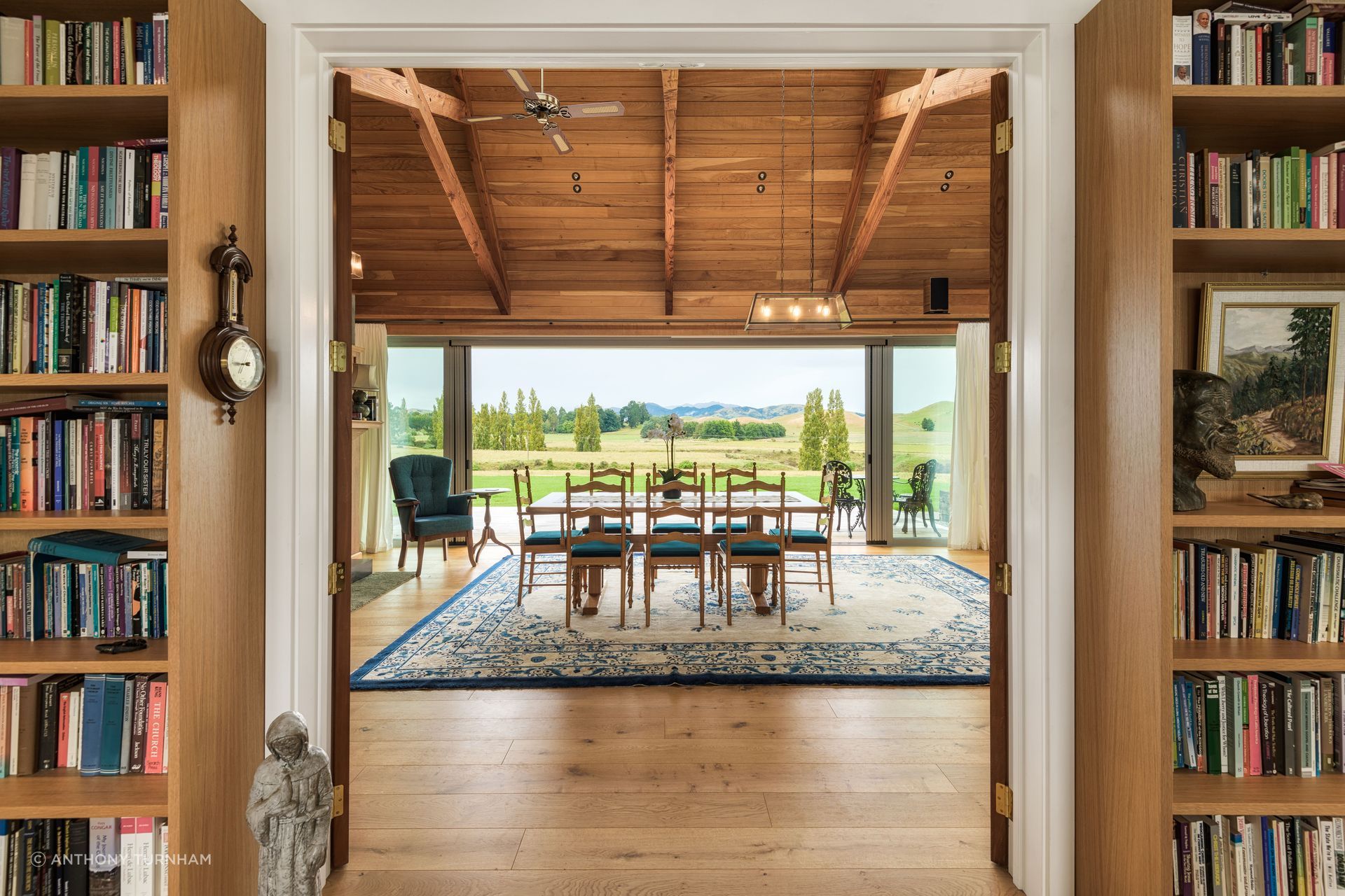 The view across the dining table. The flooring is by Forté Flooring and the ceiling is macrocarpa.