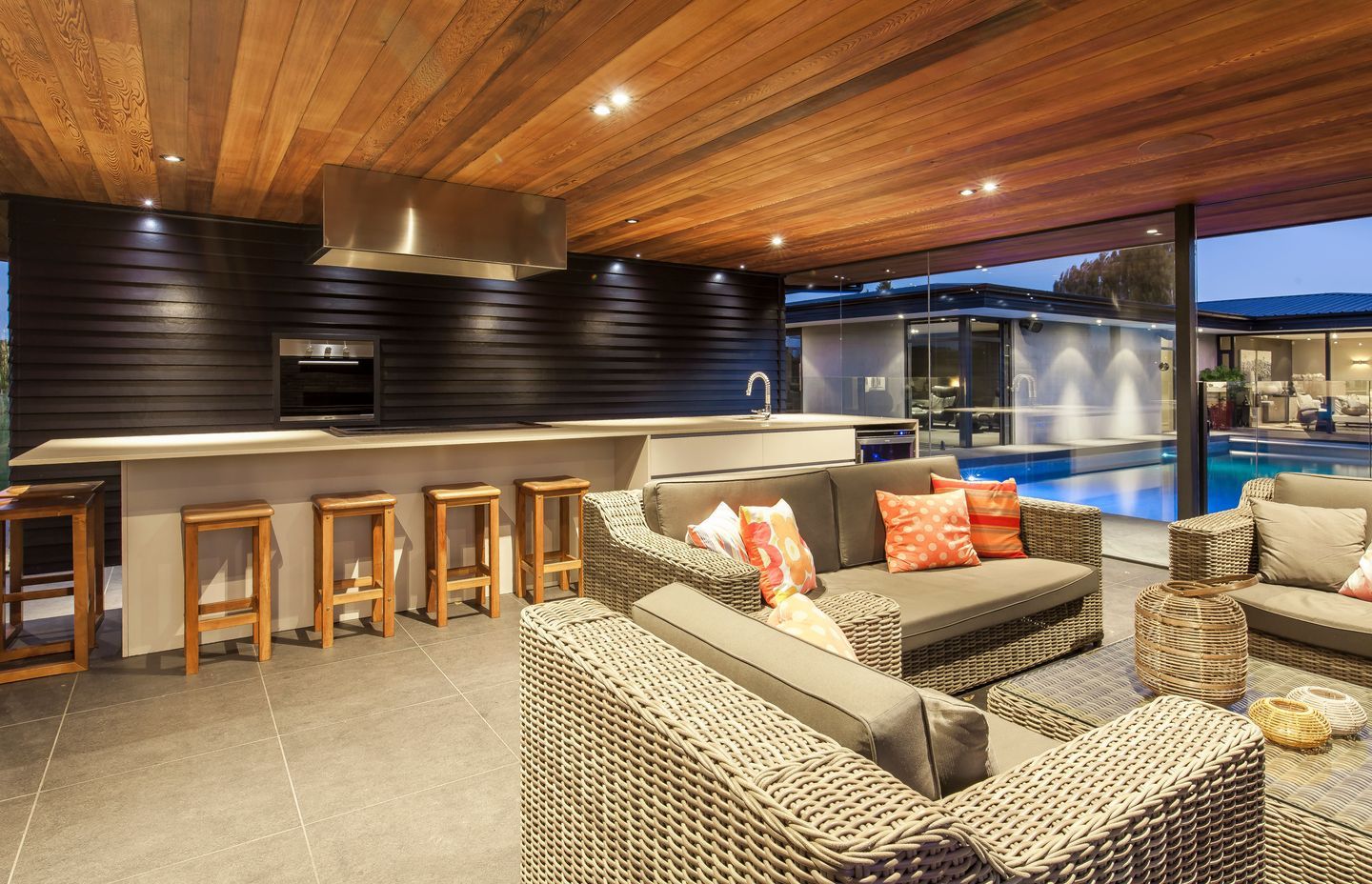 Outdoor furniture and pavers mean family and guests can enter the space directly from the pool after swimming.