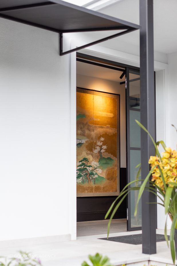 A steel canopy provides shelter in the entrance.