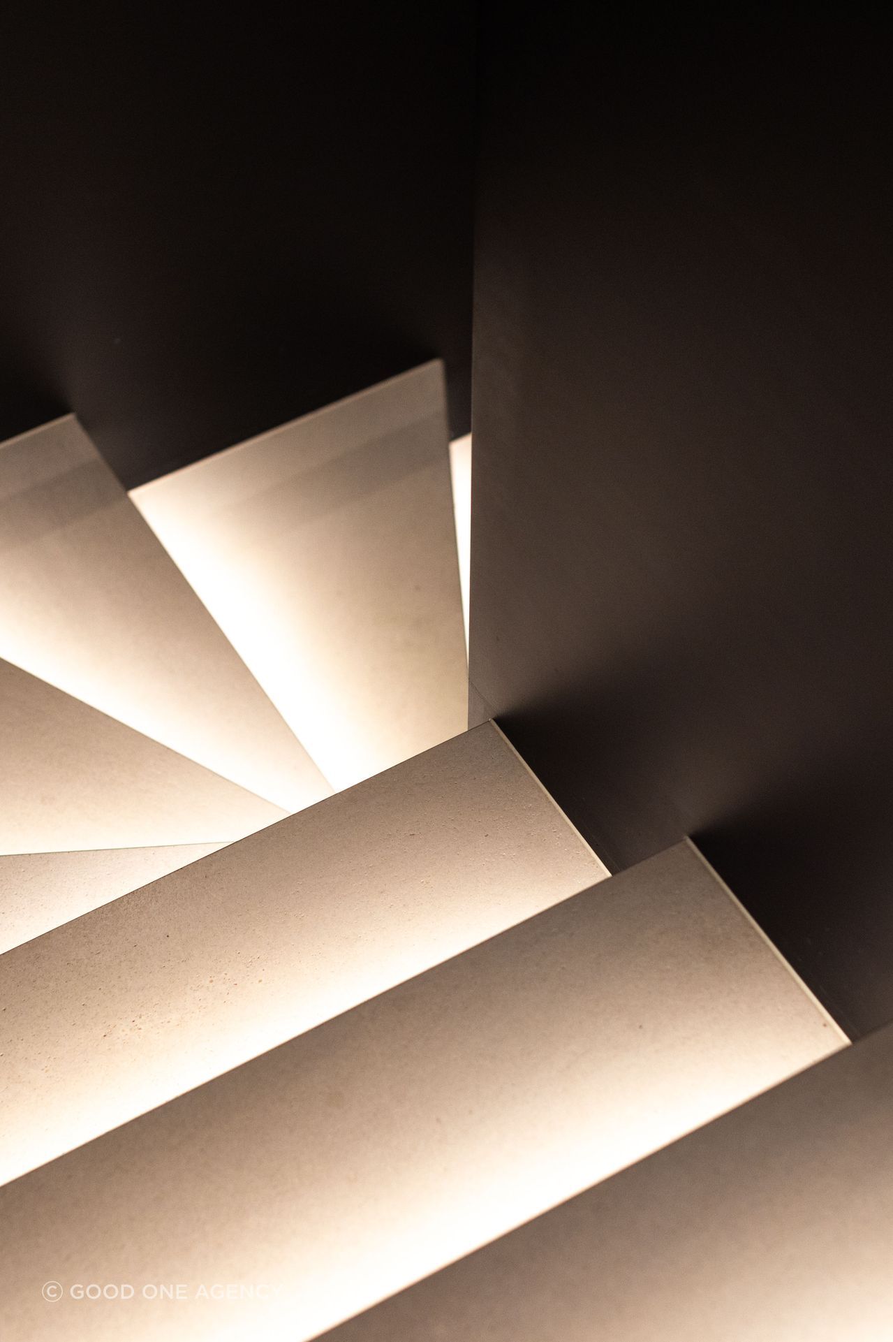 The treads on the steel stairwell are up-lit with LED lighting, creating a sculptural effect.