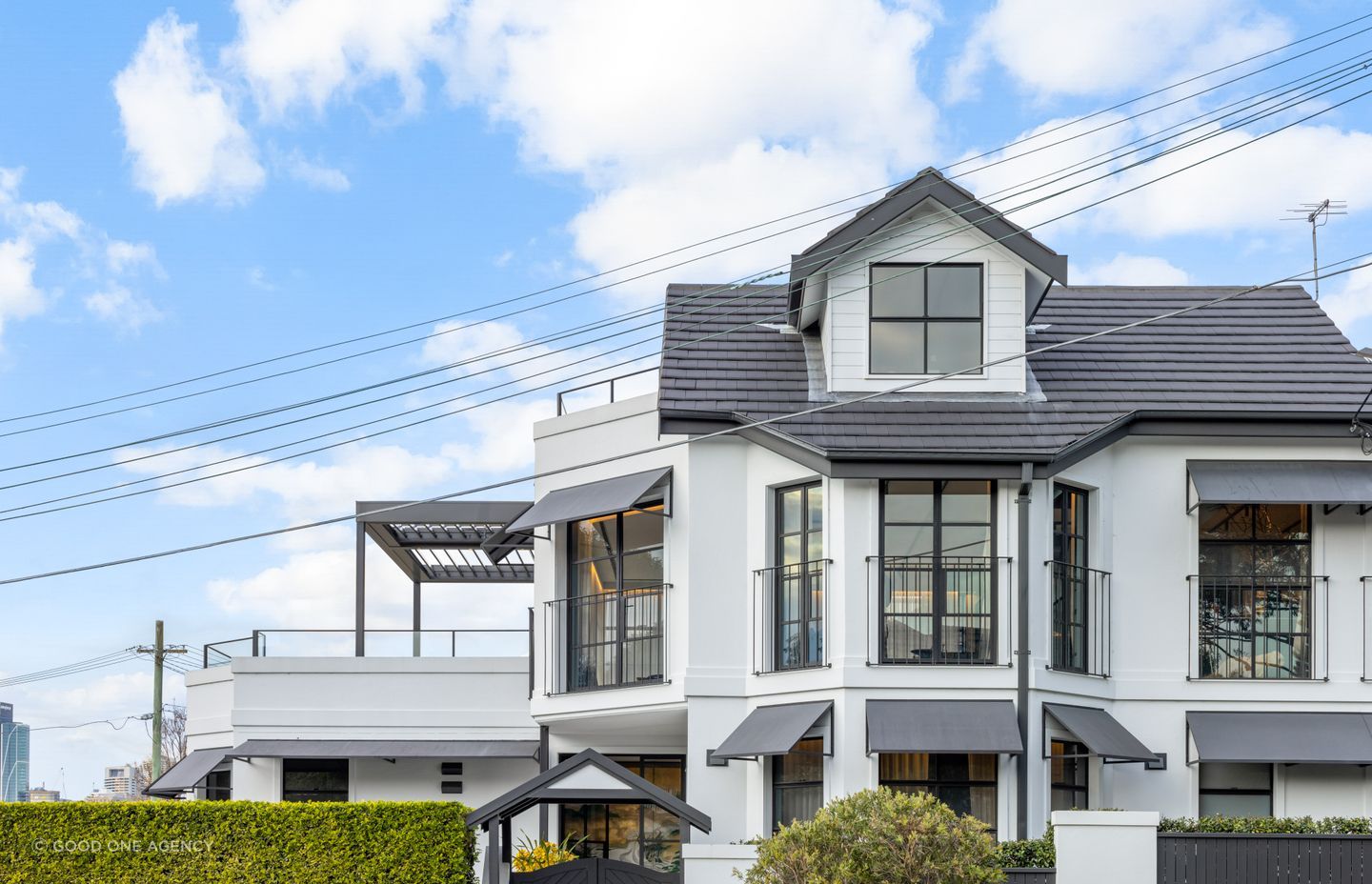 The extensive changes to the windows and doors in the home add character and street presence.
