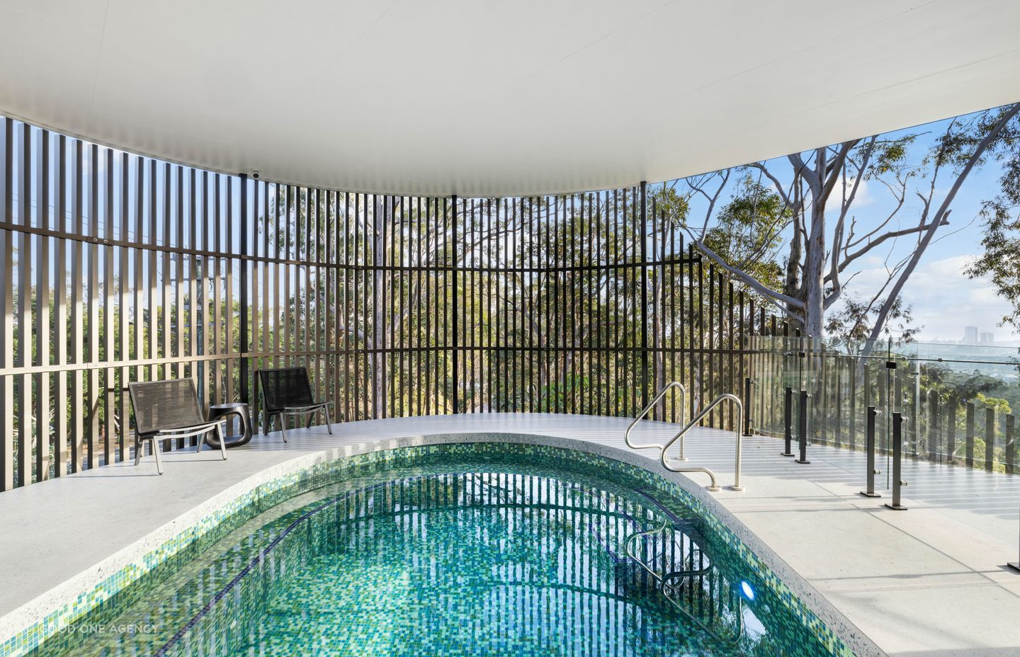 The Spanish glass mosaic tiles glitter like a jewel, drawing in the colours of the sky and sea.