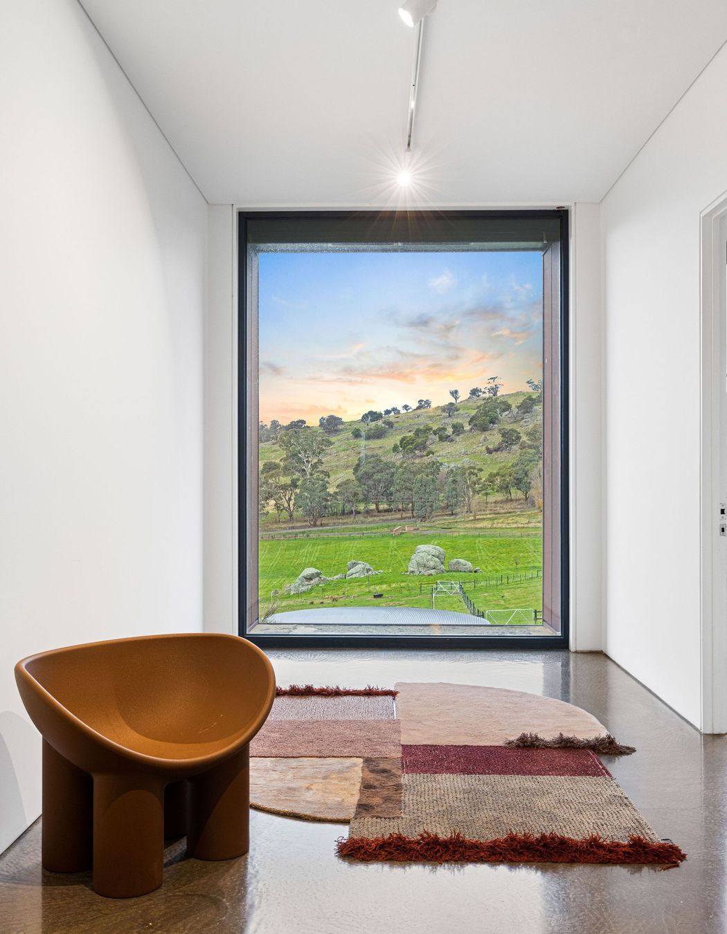 A perfectly-placed picture window transforms the scenery into a living piece of art