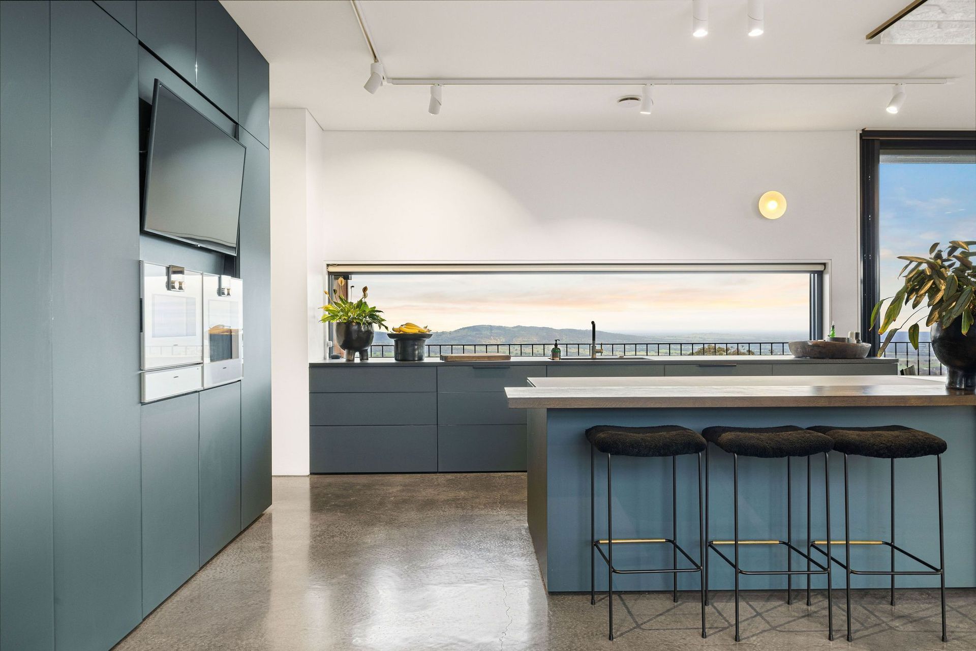 The petroleum-toned kitchen at Euroa House