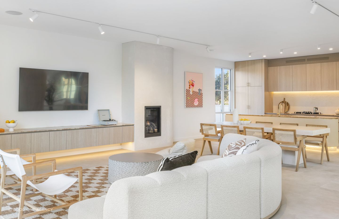 The living areas are found at the rear of the home and are open-plan.