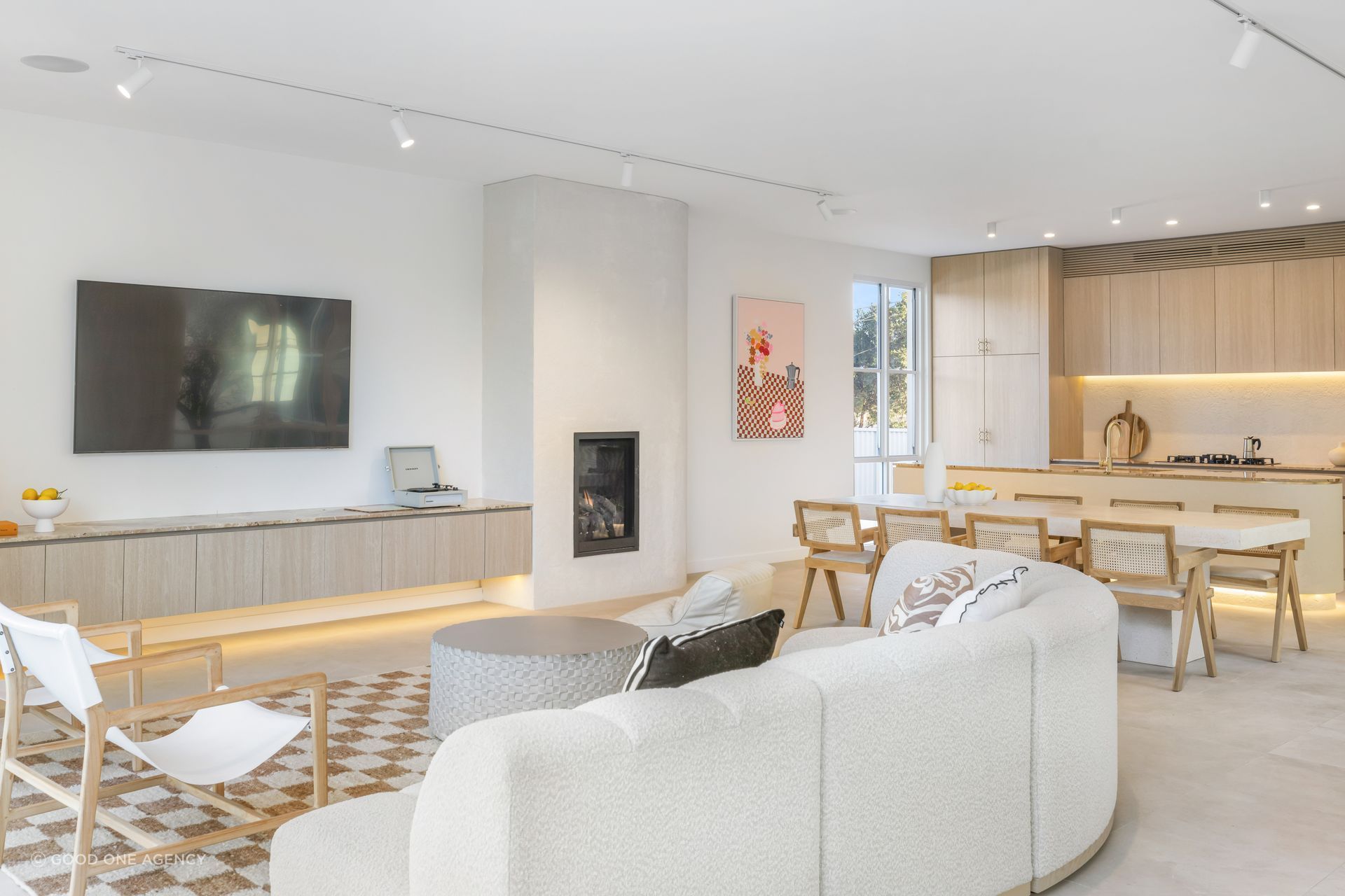 The living areas are found at the rear of the home and are open-plan.