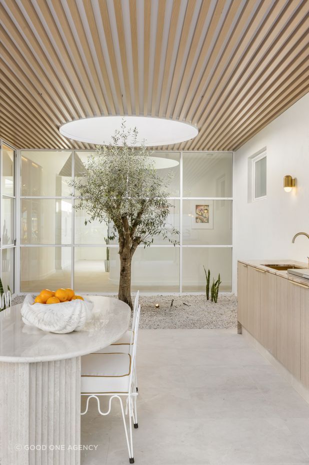 The olive tree can be seen from the front entrance and the hallway.
