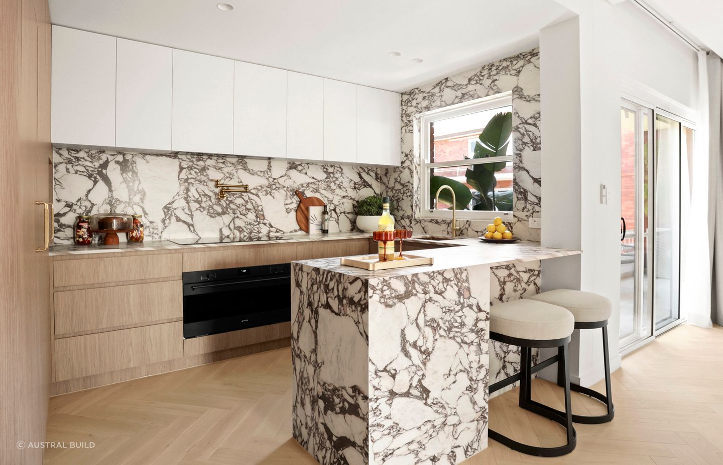 Now open-plan, the kitchen and living area has direct access to the balcony.