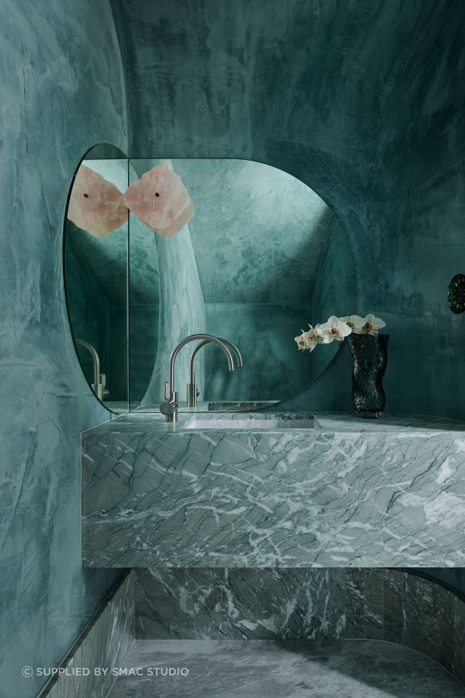 Mirror image powder room.