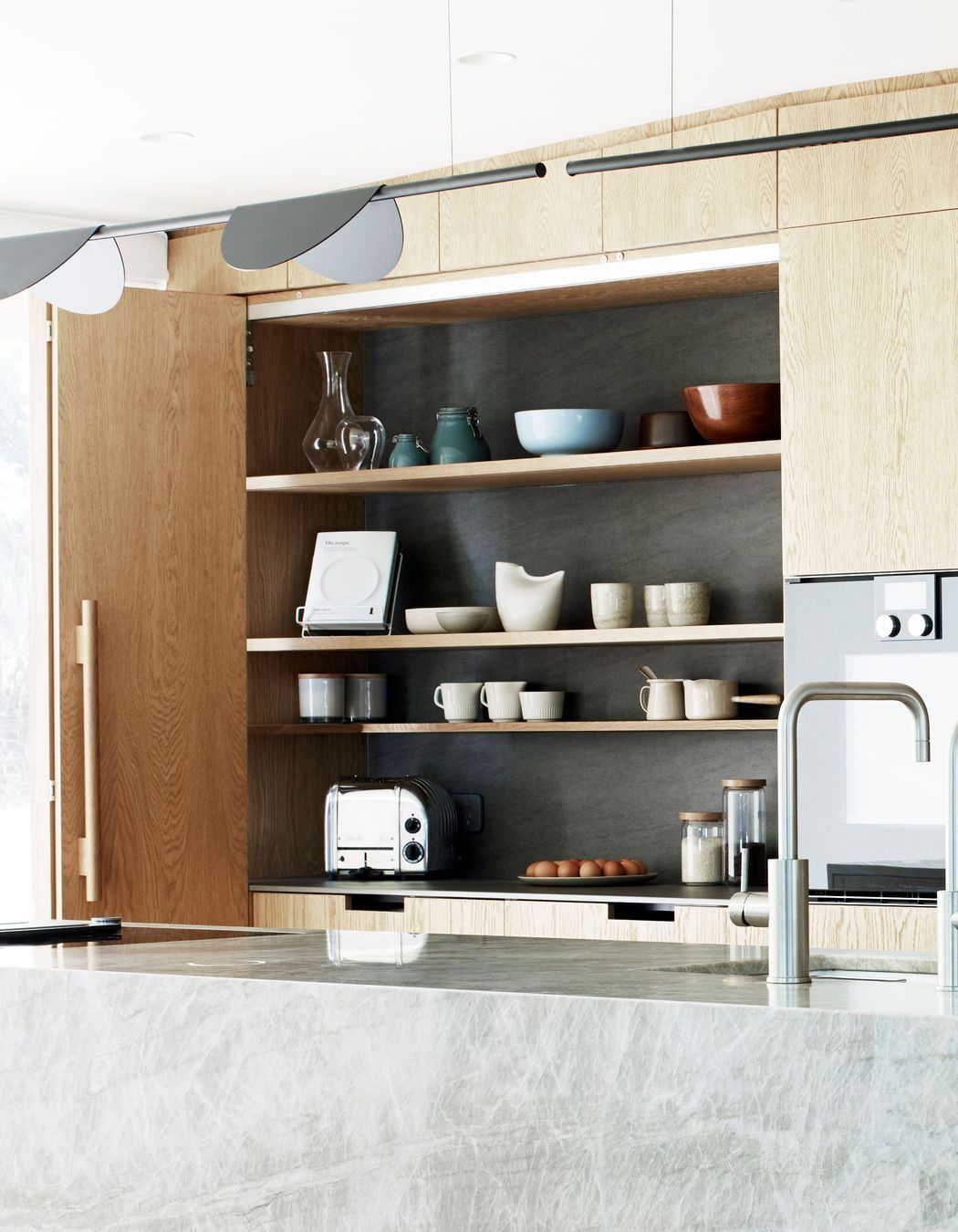 A kitchen is never going to look perfect says Natalie, who designed this extra work space to be hidden away. The tap is by Zenith.
