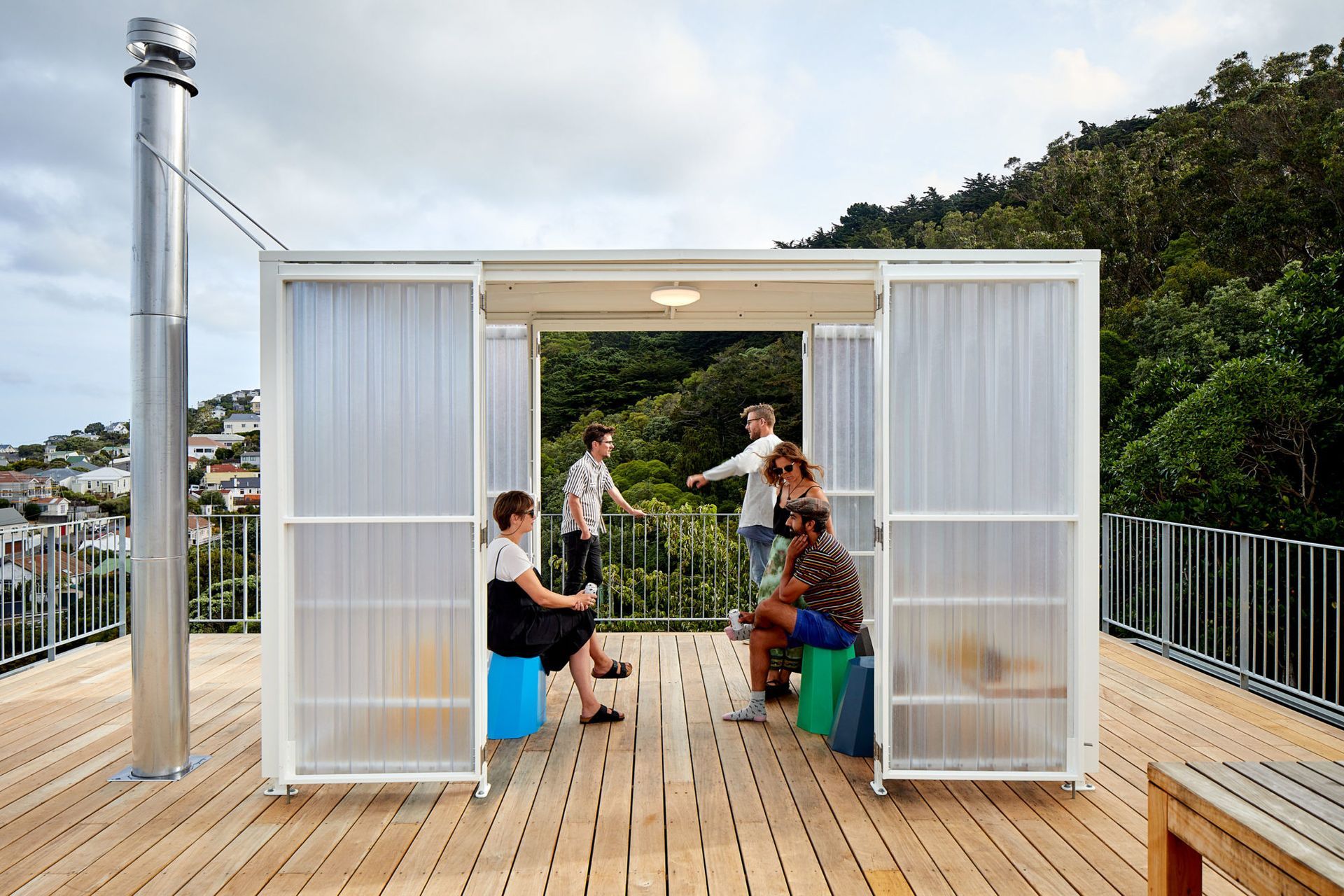 The fun and useful bus-stop-like shelter on the roof deck. Homeowner and builder Adam Pierson and wife Alicia hosted a few parties there. “Probably not as many as we would have liked. But when we did it was good,” he says.