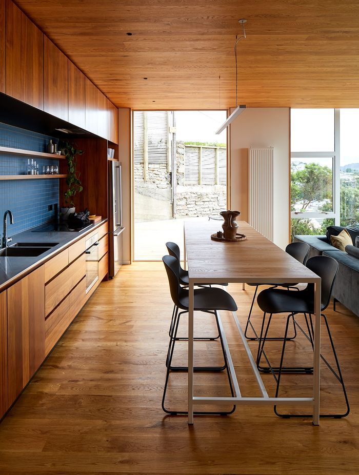 Patchwork Architecture designed the kitchen. The floors and ceilings are VidaSpace oak flooring.