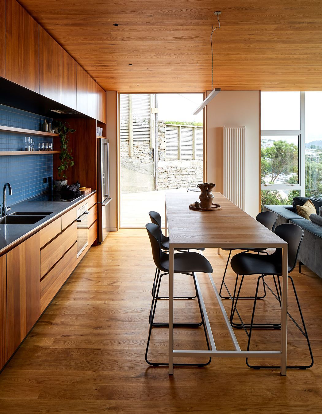 Patchwork Architecture designed the kitchen. The floors and ceilings are VidaSpace oak flooring.