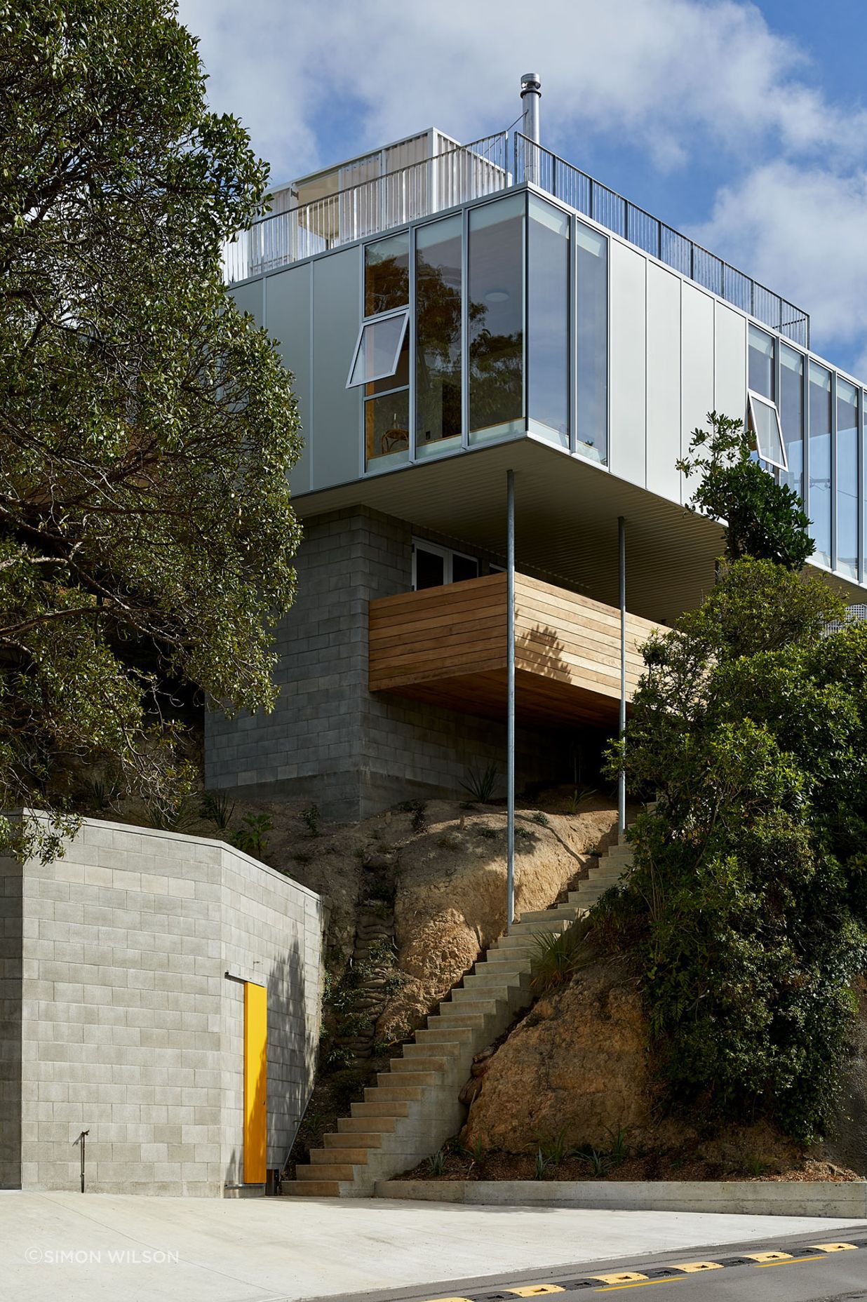 The family home designed by Patchwork Architecture. It was a tricky site, but rocky, which provided a good foundation. “So it's almost totally out of the ground. It's barely dug into the hillside at all,” says Patchwork Architecture's Ben Mitchell-Anyon.