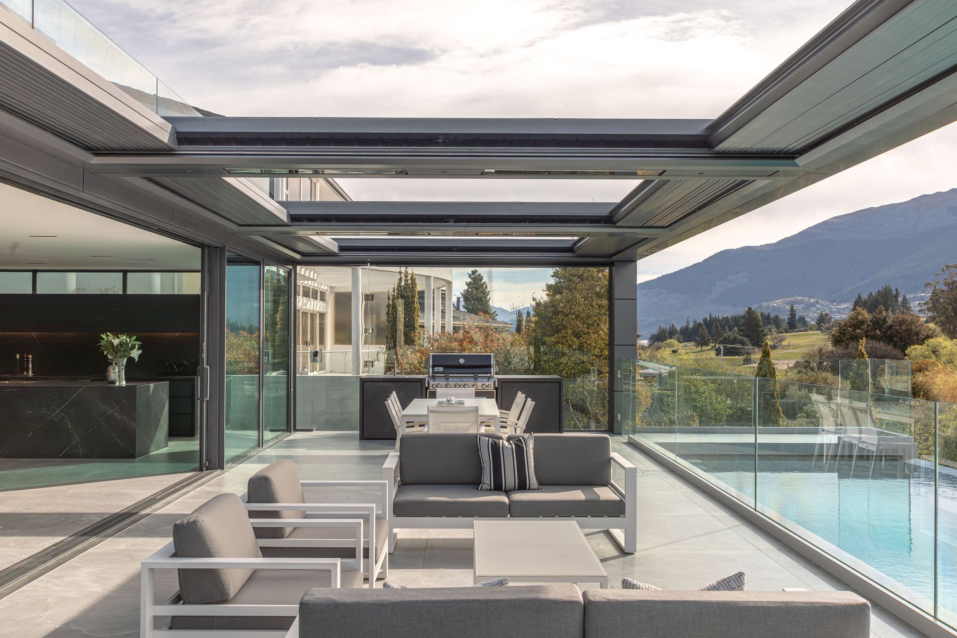 The living level flows freely onto an exterior pool terrace.