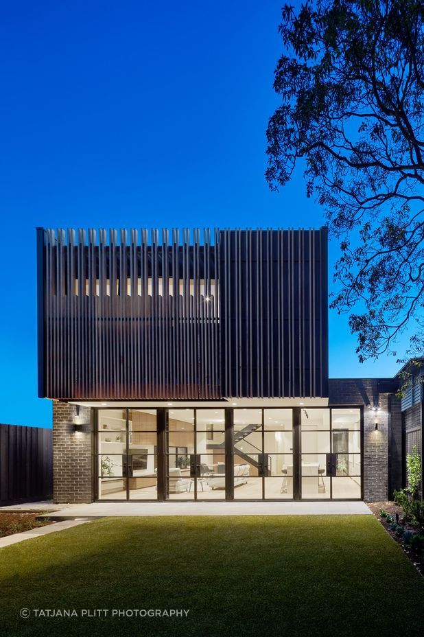 The timber slats speak to the interior materiality of the extension and complete the visual identity of the home's rear.