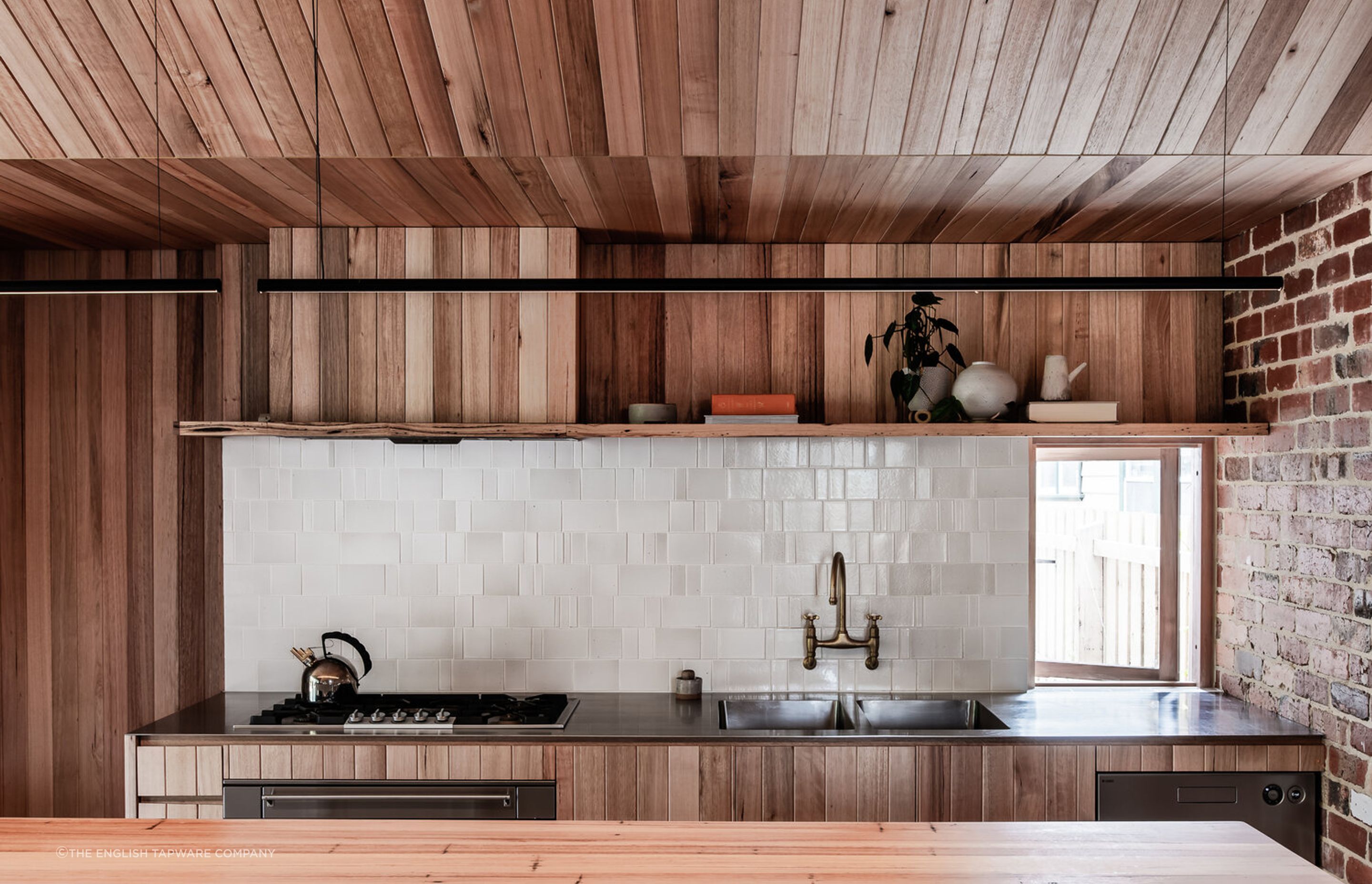 Textural warmth through wood, brick and tile in the Northcote Residence Kitchen - Photography: Tom Blachford