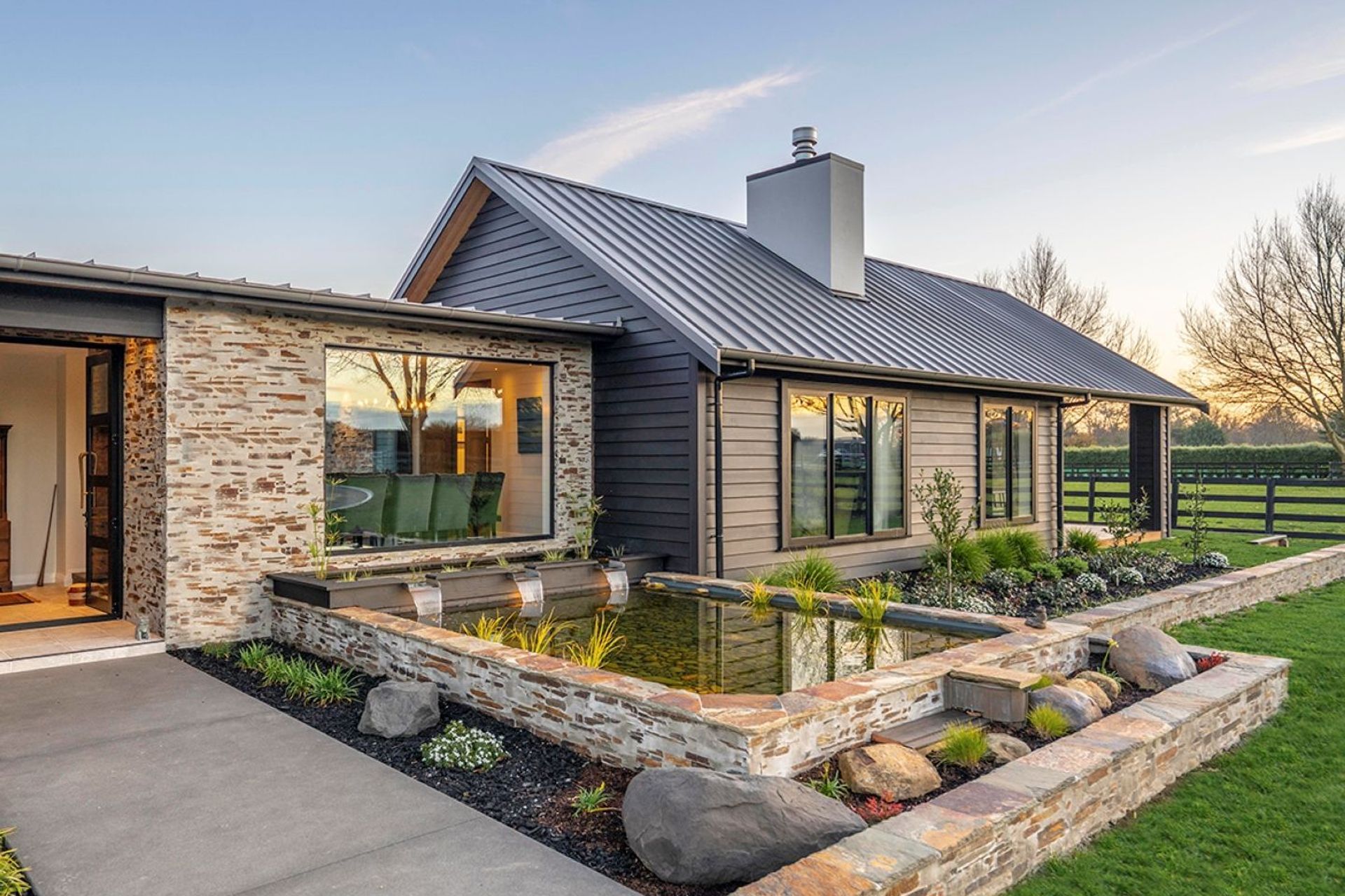 The garden water feature is a delightful addition to the outdoor space. | Photography: Locus Creative