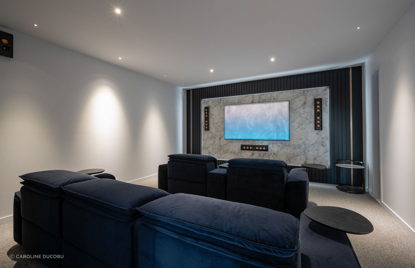 On the main floor, the theatre provides an at-home cinematic experience.