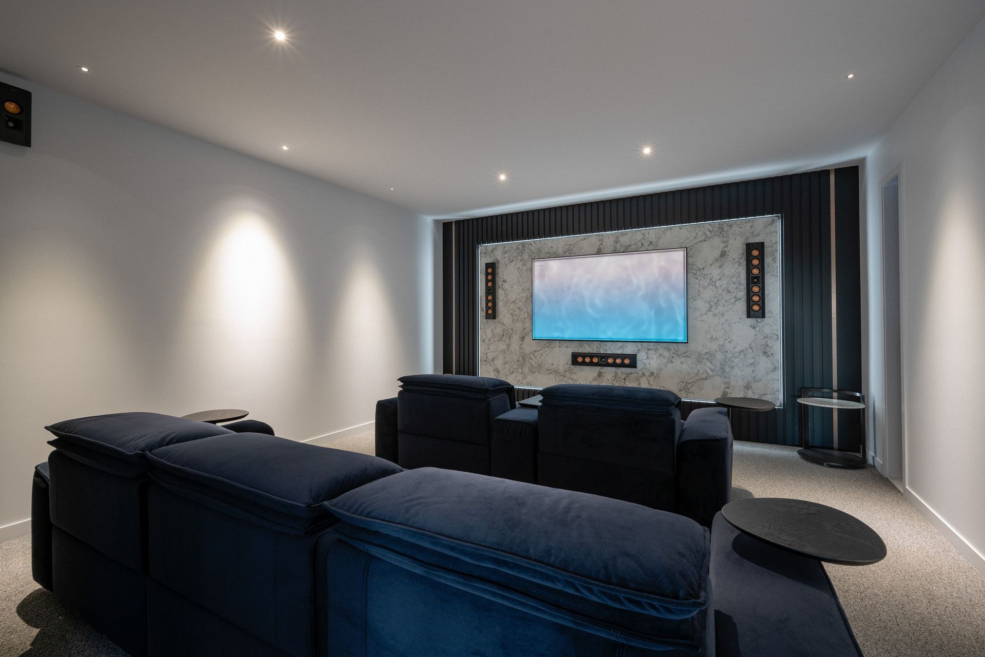 On the main floor, the theatre provides an at-home cinematic experience.