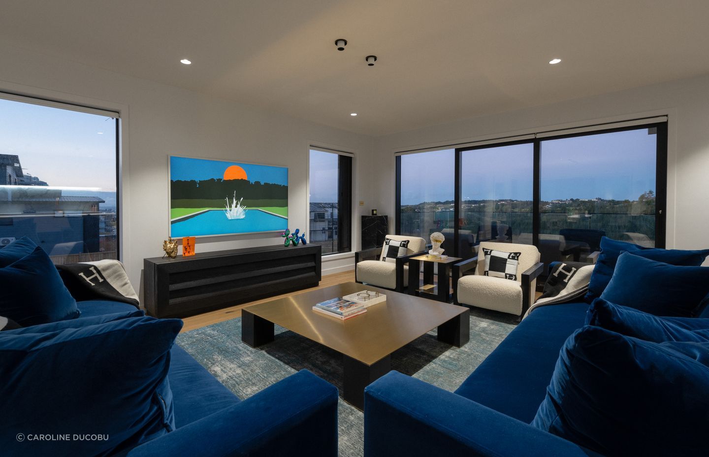 There are plenty of spaces to gather in the home, including the main lounge area.