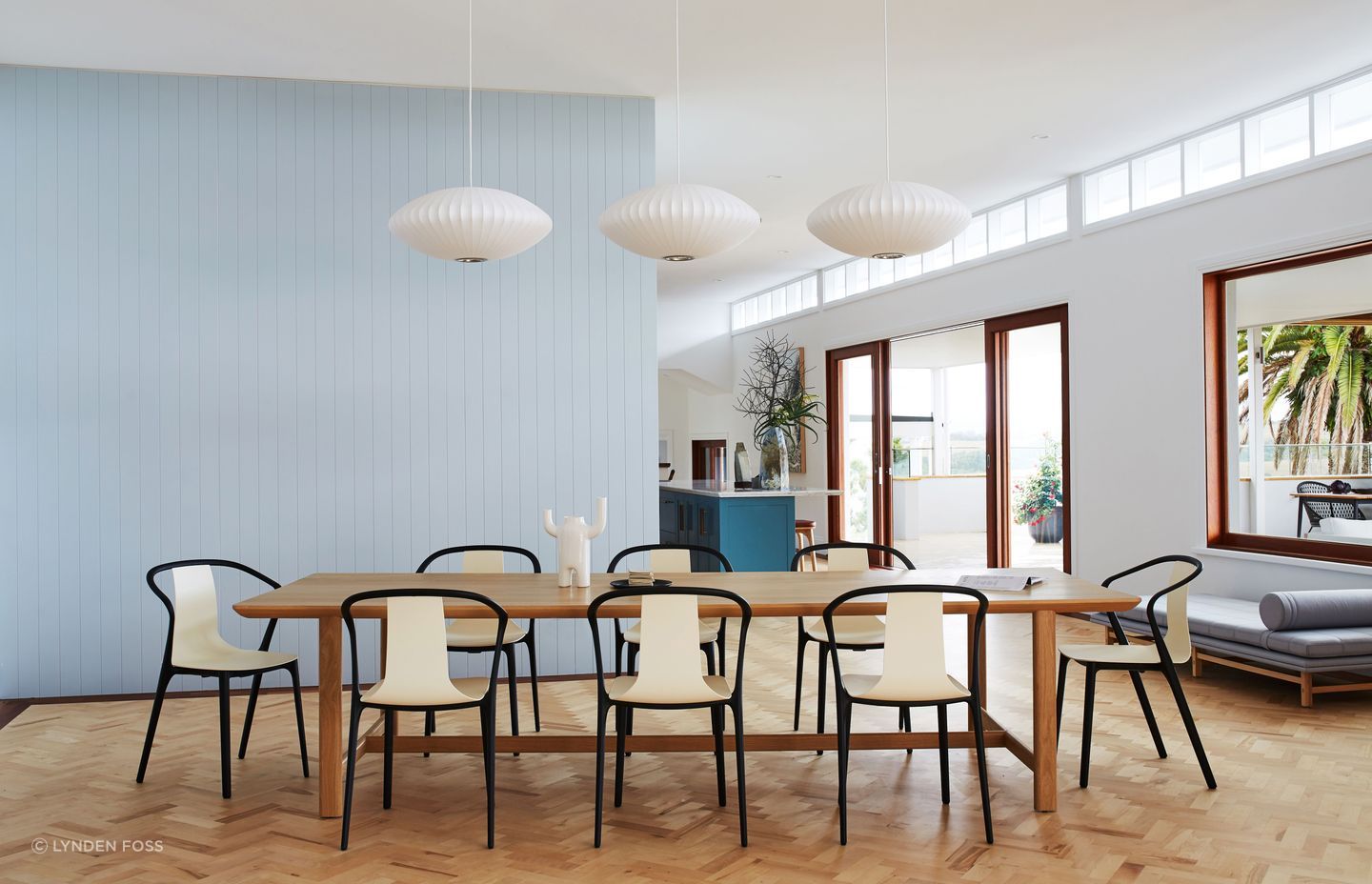 Three simple pendants highlight the dining table.