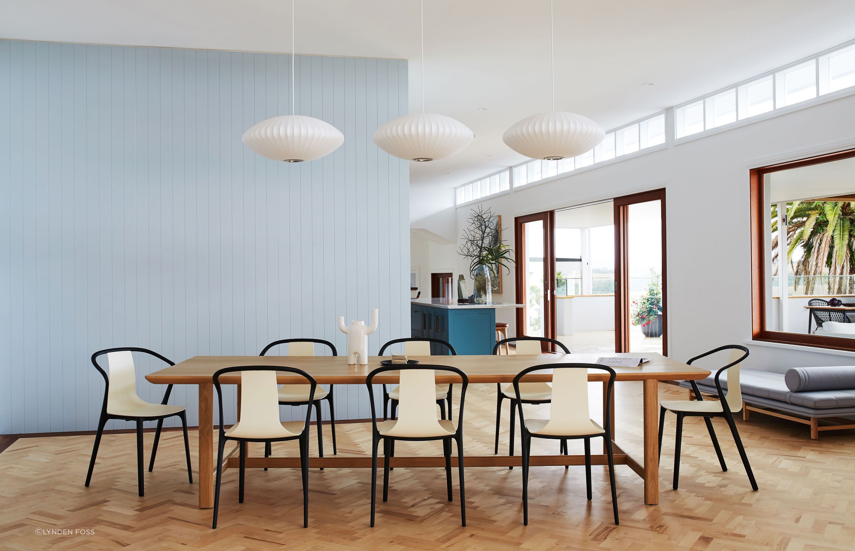 Three simple pendants highlight the dining table.