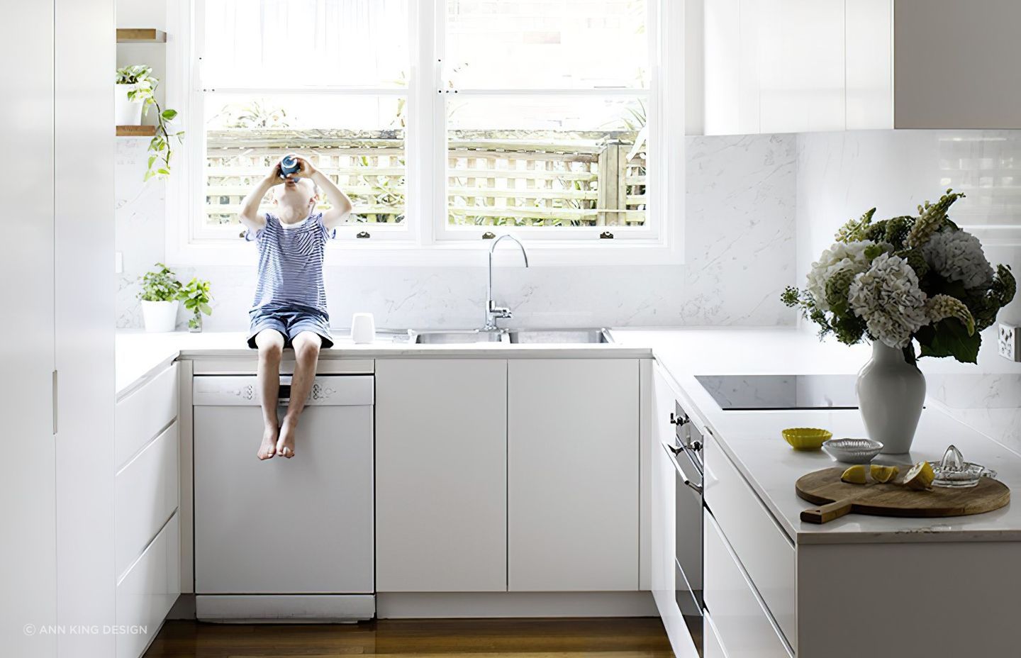 Making use of floor cabinets is key in a cosy kitchen like this one in Neutral Bay