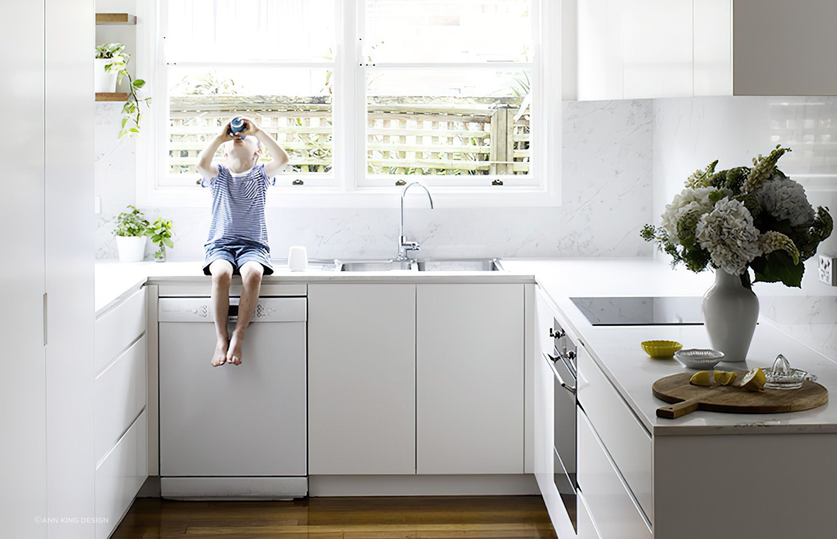 Making use of floor cabinets is key in a cosy kitchen like this one in Neutral Bay