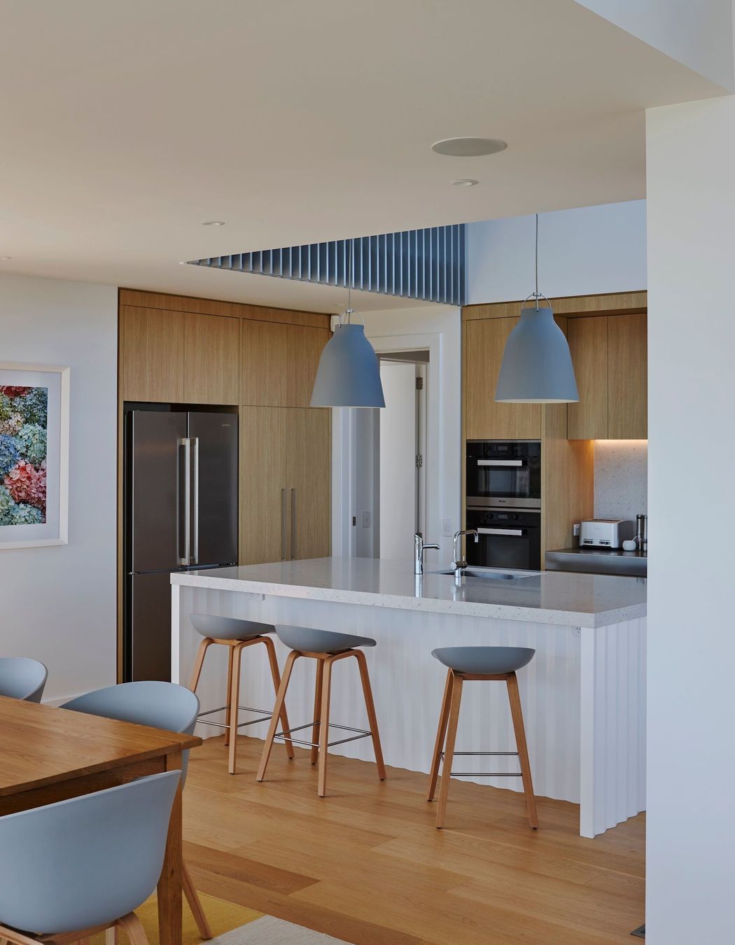 “There's quite a beautiful detail under the island bench where it has a folded origami base. We were really pleased with how they turned out. It has a little bit of crispness and a little bit of elegance to it but without being too full on,” says Kate.