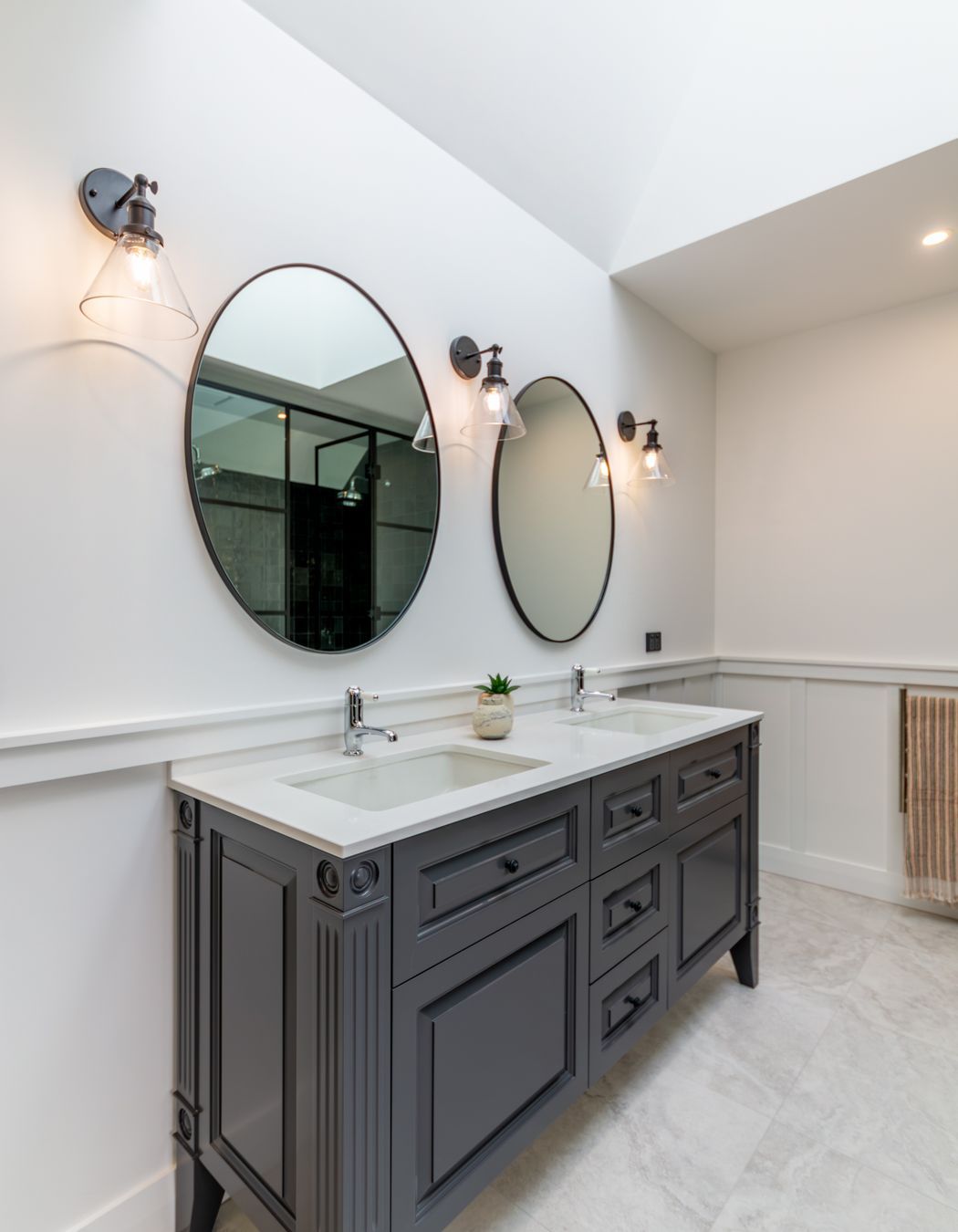 Skylights let light into the master en suite. The character detailing is also extended into the bathroom spaces.